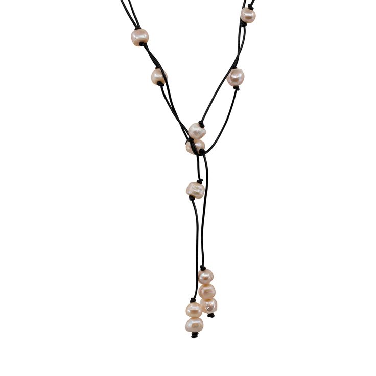 One of our most popular styles! Susanne pairs black leather with dark grey freshwater pearls for an intriguing lariat look that shows off your cool, sophisticated side. As these lustrous pearls catch the light, their metallic colors shimmer and shine.Each piece of jewelry created by The Freshwater Pearl Company features genuine freshwater cultured pearls. Our collections are proudly designed in Palm Springs and distributed in the U.S. from our San Diego studio for a touch of California coastal s Adjustable Pearl Pendant Lariat Necklace, Adjustable Long Lariat Necklace With Pearl Drop, Adjustable Pearl Lariat Necklace With Pearl Charm, Elegant Leather Lariat Jewelry, Formal Adjustable Lariat Necklace With Pearl Drop, Adjustable Long Lariat Necklace With Pearl Pendant, Elegant Adjustable Leather Necklaces, Elegant Black Lariat Necklace With Adjustable Length, Adjustable Black Pearl Necklace