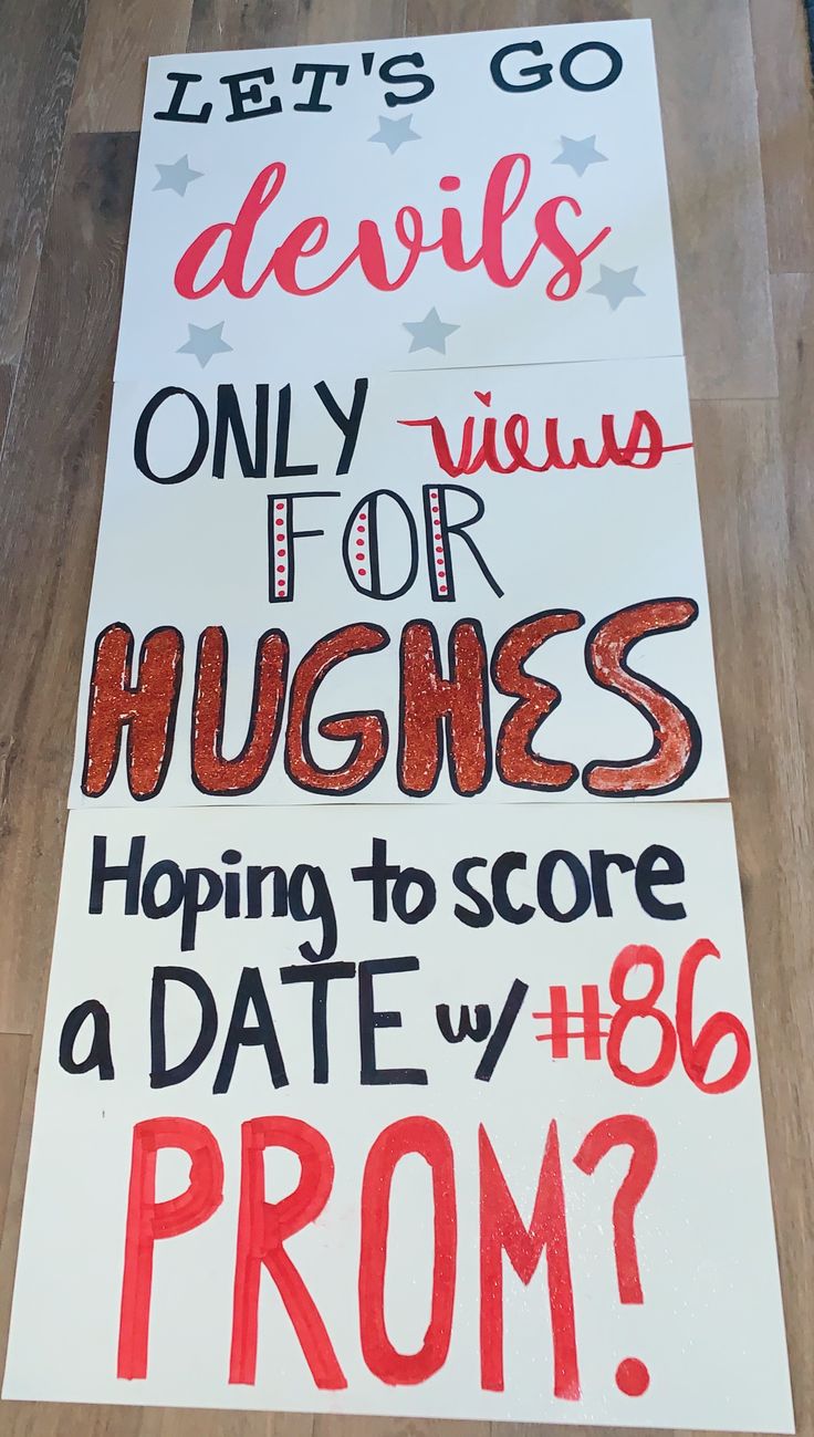 two signs on the floor that say, devil devils only want for hugs hoping to score a date with 86 proms