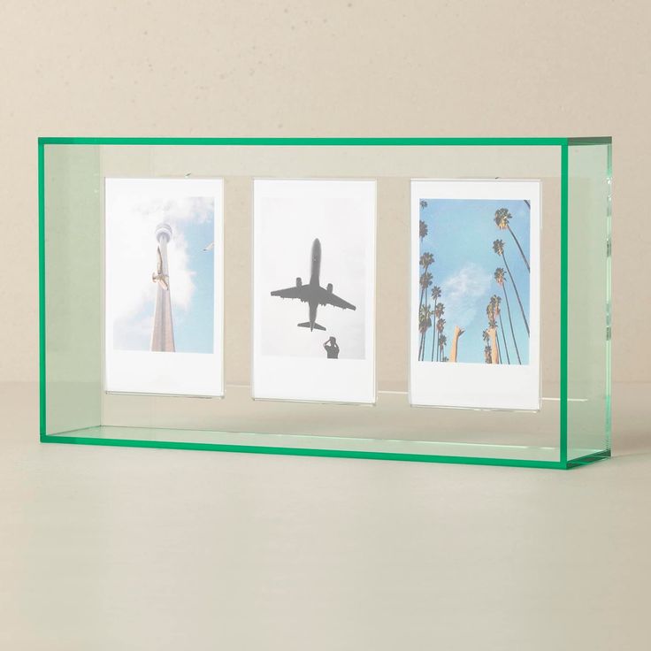 three pictures in a glass frame with an airplane flying over the top and palm trees below