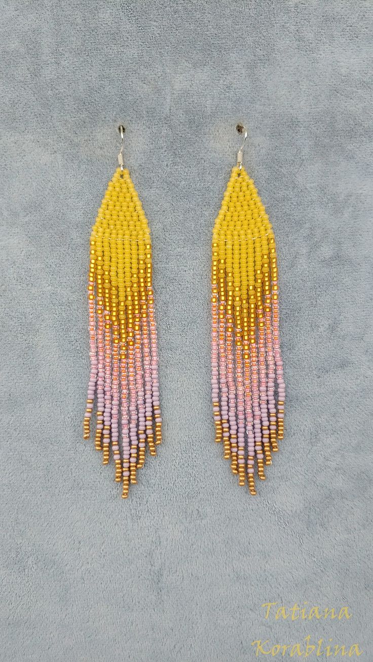 These unique handmade earrings are made of high-quality Czech beads and strong synthetic thread. They are elegant, fashionable, and highly versatile, suitable for everyday wear. Color: yellow,orange,coral, purple,gold . There may be some color discrepancies which is due to the different monitor settings 100% hand made with love! Measurements: Length-about  12cm (4.7 inch) Width -about  2 cm (0.79 inch) Materials: Sterling silver components Czech glass beads Strong bead weaving thread Summer Gold Beaded Dangle Earrings, Yellow Dangle Jewelry With Tassels, Summer Gold Beaded Earrings, Gold Tassel Jewelry For Summer, Summer Gold Tassel Jewelry, Gold Tassel Dangle Earrings With Colorful Beads, Summer Jewelry With Colorful Long Drop Beads, Gold Dangling Beads Earrings For Summer, Handmade Yellow Dangle Tassel Earrings