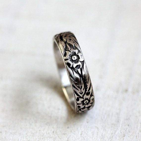 Sterling silver or gold floral pattern ring. This flower pattern ring makes a wonderful woman's wedding ring or a great everyday ring. I have oxidized the recesses to bring out the lovely detailed pattern of this ring. The band is a dome shape and measures 5mm high and 1.75mm wide at the widest point. Please note that there is a small seam where I have soldered the ring together. It is hard to detect but want to mention it. This ring is available in sterling silver and 14 karat yellow gold. The Silver Flower Ring, Pattern Ring, Sterling Silver Flowers, Silver Band Ring, Womens Wedding Bands, Gold Floral, Silver Flowers, Wedding Rings For Women, Silver Band