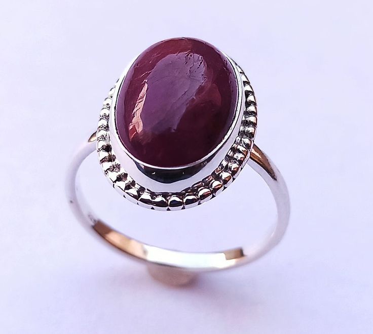 925 solid sterling silver fashionable handmade minimalist ring, with Natural Indian Ruby gemstone. Ring Weight - 4.40 Gram Stone Size - 10 X 14 MM (Indian Ruby) Ring Size - Choose From Variation Please, This ring is made from 925 sterling silver. This natural Indian Ruby Cabochon ring is finely polished to give a brilliant mirror finish. With rejuvenating design and sleek appearance, this ring looks stunning on fingers. If you have any additional questions about this Product, just hit the "Ask a Oval Sterling Silver Ruby Ring Stamped 925, Oval Ruby Ring In Sterling Silver Stamped 925, Classic Sterling Silver Cabochon Ruby Ring, Silver Ruby Ring With Oval Cabochon, Sterling Silver Ruby Ring Oval Cabochon For Formal Events, Classic Sterling Silver Ruby Ring With Cabochon, Sterling Silver Ruby Ring, Oval Cabochon For Formal Events, Formal Sterling Silver Ruby Ring With Oval Cabochon, Simple Oval Silver Jewelry