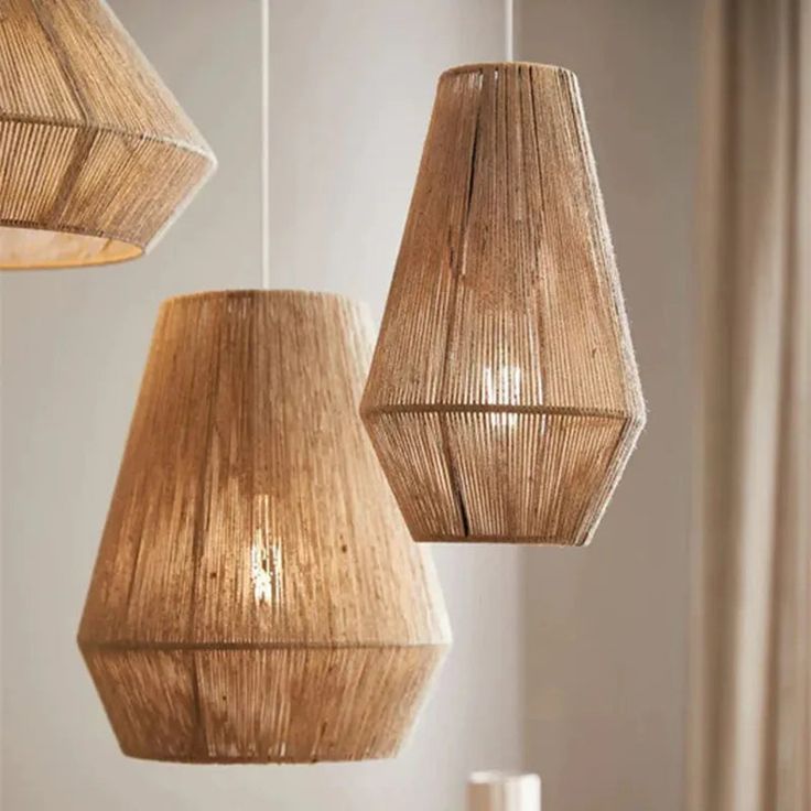 three wooden lamps hanging from the ceiling