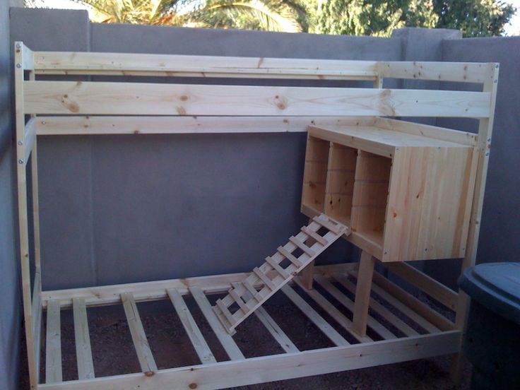 a wooden bunk bed sitting next to a wall