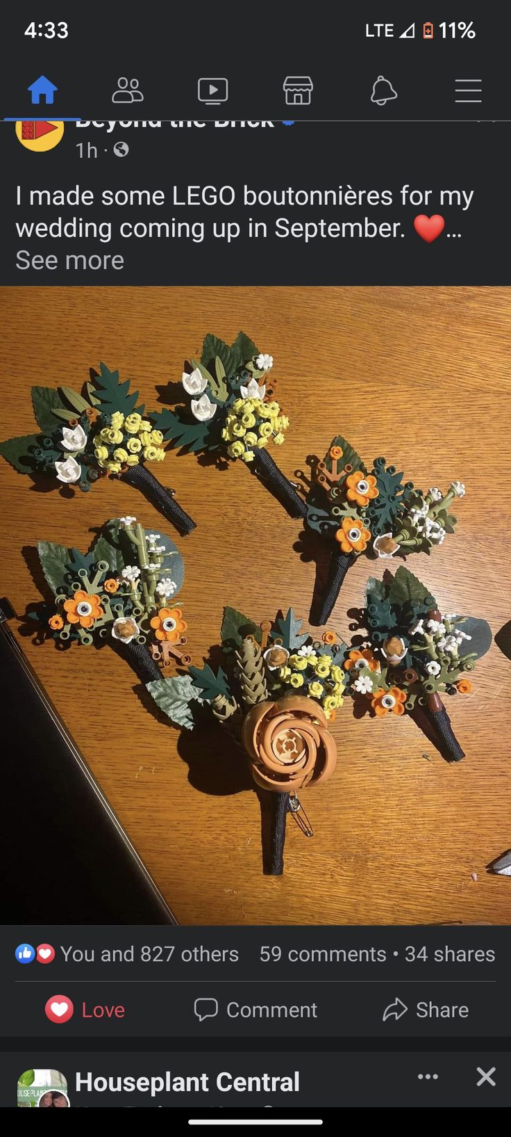 three fake flowers are placed on top of each other in front of a wooden table