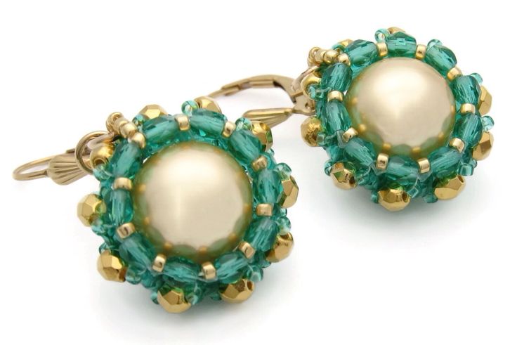 These richly colored gold and green earrings are eye-catching and will be noticed when you wear them.  Gold Swarovski pearls are set in transparent green and gold Czech fire polished beads, and Japanese seed beads. They are finished with 14k gold-filled French lever back earwires.  Approximately 3/4 inch diameter and length. Free USA shipping and sent in a gift box. Thanks for looking at my Etsy shop. Elegant Green Beaded Earrings With Gold Beads, Elegant Green Earrings With Gold Beads, Earrings Gold Pearl, Woven Earrings, Pearl Earrings Gold, Earrings Bead, Gold And Green, Mismatched Earrings, Gold Pearl Earrings