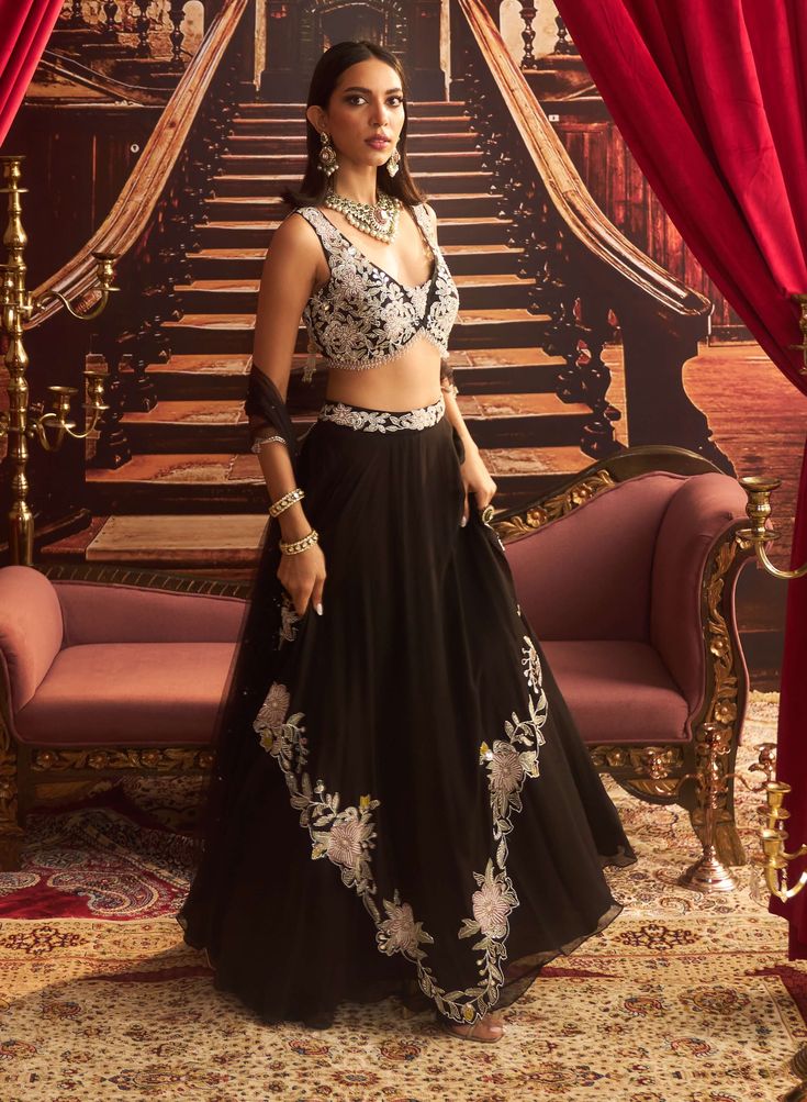 Step into sophistication with this black embellished draped jumpsuit, designed to accentuate your silhouette with its fluid draping and intricate details. Perfect for evening events, this ensemble offers a chic, modern look that effortlessly combines comfort and glamour. Scallop Border, Vacuum Storage, Embroidered Lehenga, Indian Wedding Wear, Lehenga Blouse, Embroidered Dupatta, Embellished Blouse, Sleeves Blouse, Intricate Embroidery