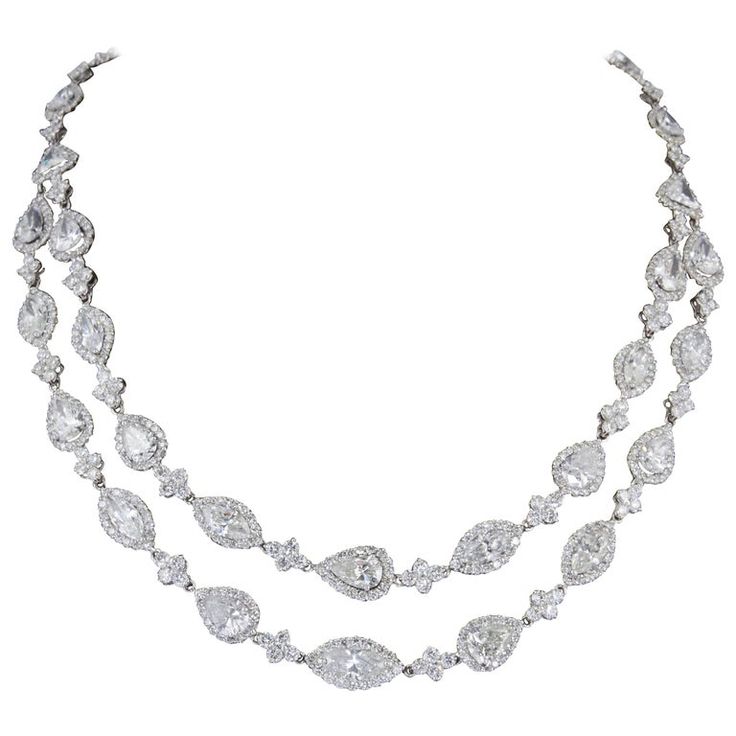 A beautiful diamond necklace! Multiple shaped large diamonds each surrounded by smaller white round brilliants. 31.85 carats of pear, marquise, trillion, and emerald cut center diamonds surrounded by 16.22 carats of round brilliant diamond halos and diamond links. A total of 48.07 carats! F/G VS/SI. The center diamonds average over 1 carat each! 18k white gold Beautiful Diamond Necklace, Sapphire Diamond Pendant, Antique Necklaces, Diamond Choker Necklace, Marquise Shape Diamond, Diamond Cluster Earrings, Bling Necklace, Swirl Earrings, Diamond Choker