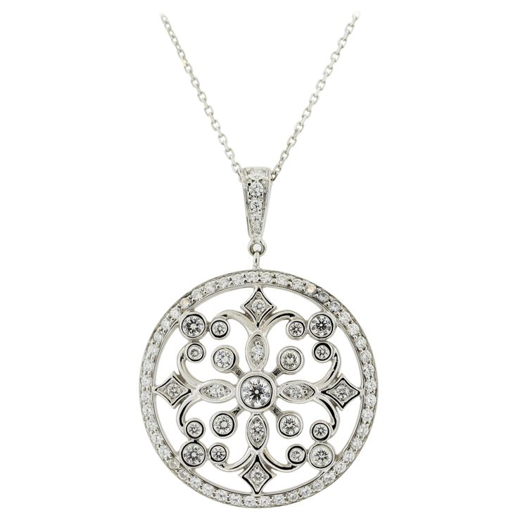 A lovely diamond pendant made in 18k white gold. It features a total of 2.16 carats of round brilliant-cut diamonds set around the pendant in stylish patterns. There are smaller rounds set on the border of the medallion while larger stones are set in the middle of the pendant in its filigree pattern. Made in 18k white gold and ready to be worn! Pendant Length: 1.6 inches Chain Length: 18 inches Weight: 12.4 grams Filigree Pattern, Gold Medallion, Diamond Gold, Round Brilliant Cut Diamond, Brilliant Cut Diamond, Diamond Pendant, Round Brilliant, Chain Lengths, Chain Length