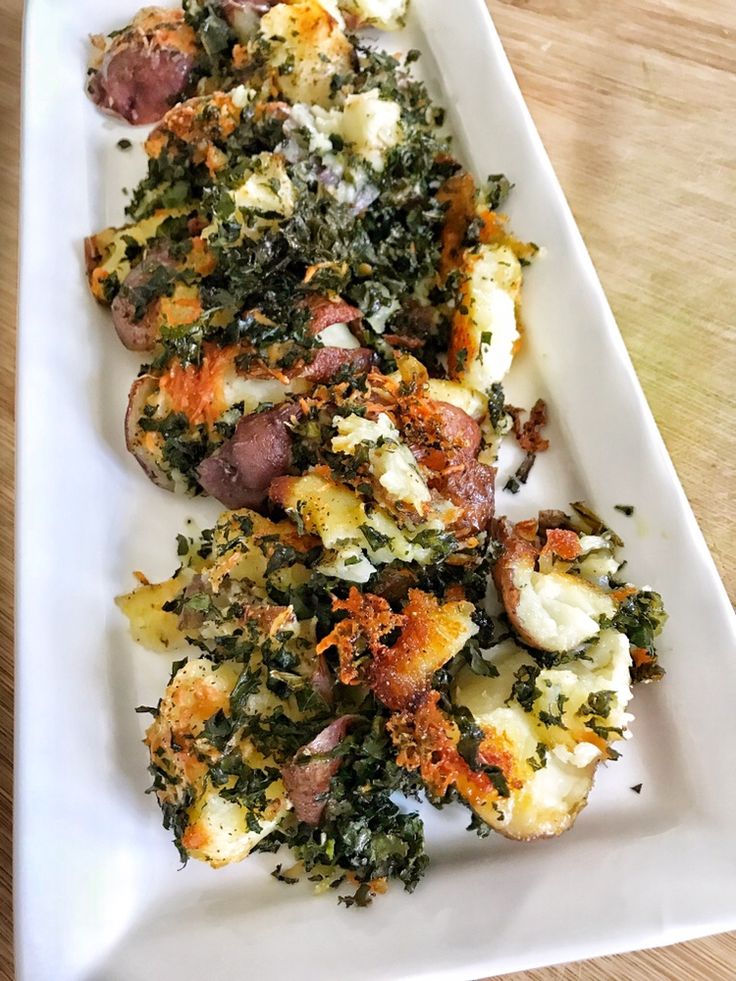 a white plate topped with food on top of a wooden table