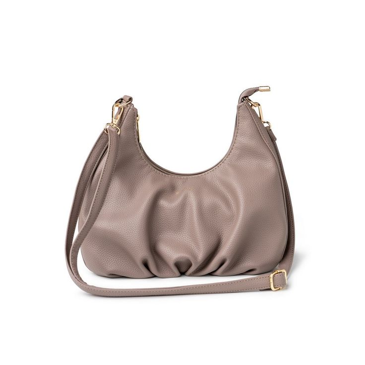 Crafted from premium, cruelty-free vegan leather, this bag combines the luxurious look and feel of genuine leather with a commitment to sustainability and animal welfare. Its sleek, minimalist design makes it a versatile accessory, perfect for elevating any outfit, from casual daytime looks to more sophisticated evening ensembles. Featuring a spacious main compartment secured by a zipper closure, the Elle Shoulder Bag is as functional as it is stylish. Inside, you'll find a soft, durable lining Chic Textured Leather Hobo Bag For On-the-go, Textured Faux Leather Crossbody Shoulder Bag, Elegant Taupe Textured Leather Shoulder Bag, Versatile Faux Leather Crossbody Satchel, Chic Textured Leather Baguette Bag For Travel, Chic Soft Leather Baguette Bag For Travel, Textured Faux Leather Crossbody Bag, Everyday Textured Leather Crossbody Baguette Bag, Versatile Faux Leather Shoulder Bag With Soft Leather