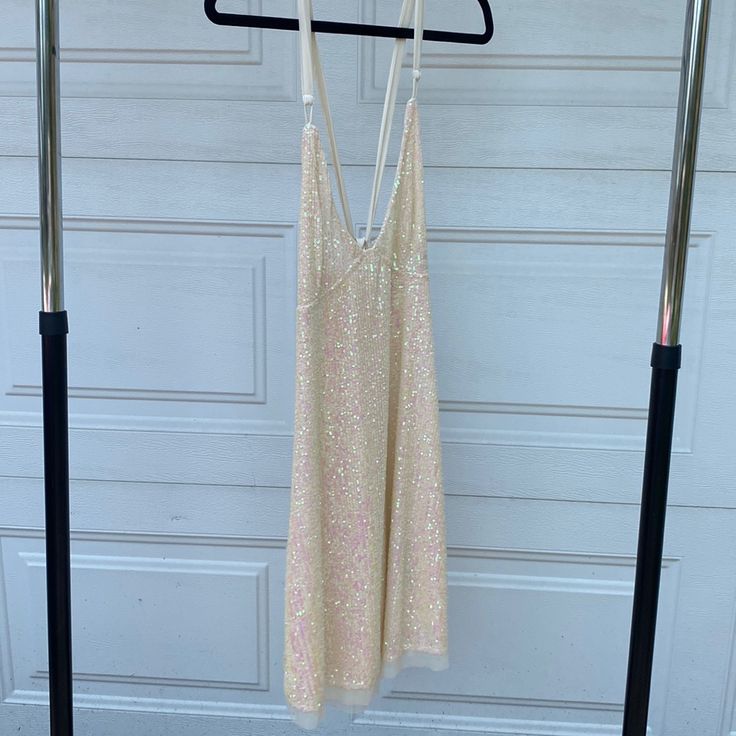 Brand New Free People Glitter Dress! Size Large Never Worn Champagne Shimmer Summer Dress, Summer Champagne Shimmer Dress, Champagne Sparkling Sequin Dress For Night Out, Spring V-neck Shimmer Mini Dress, V-neck Shimmer Mini Dress For Spring, Champagne Mini Sequin Dress For Summer, Champagne V-neck Sequin Dress For Night Out, Champagne V-neck Mini Dress With Sequins, Champagne Sequined V-neck Mini Dress