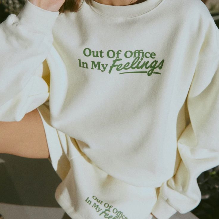 Cream Crewneck 50% Cotton 50% Polyester 'Out Of Office, In My Feelings' Screen Printed Across Chest In Green 'Mayfair' Embroidered On Back Collar In Green Model Is 6'0" And Is Wearing S/M (Wash Care Instructions) Turn Inside Out And Machine Wash Cold With Like Colors (Dry Care Instructions) Hang Dry Pair With Fleece Sweatshort Unisex One Size - S/M In My Feels, Graphic Shirt Design, Crewneck Design, Shirt Design Inspiration, Out Of Office, In My Feelings, My Feelings, Foto Ideas Instagram, 로고 디자인