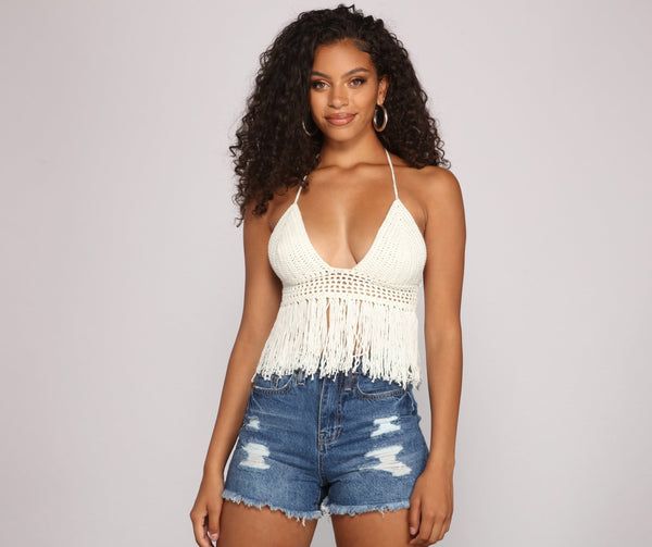 Keep it festive in this adorable fringe halter top! It features a sleeveless bodice. halter straps that lead to a back tie closure. a deep V neckline. a sheer inset underneath the bust. and fringe detailing that flows down. The top is composed of a crochet fabric with moderate stretch.Model is 5'8" with a 32" bust. 23" waist and 36" hips. She is wearing a size small. Fringe Halter Top, Grey Wig, Bodycon Dresses Casual, Crochet Fabric, Pink Prom Dresses, Halter Tops, Dress And Heels, V Neckline, Cocktail Dress Party