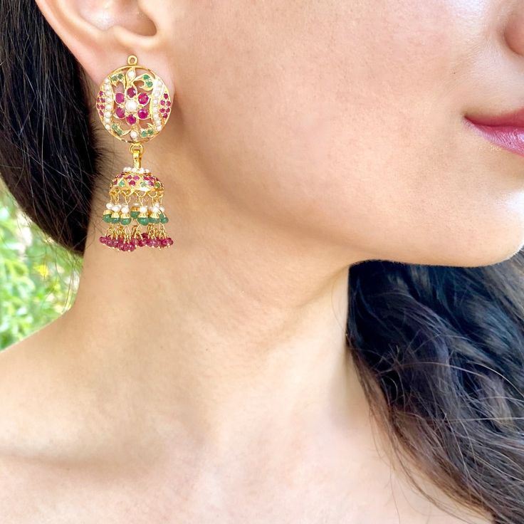 Featuring a pair of jadau jhumka earrings in 22k gold. This timeless piece adds a hint of sophistication and sparkle to any wardrobe, ensuring you look and feel your best no matter the occasion. This exquisite piece of jewelry is sure to become a treasured keepsake for years to come, making it the perfect gift for any occasion. The earrings weigh 23.59 gms including 3.98 gms in the hanging rubies, emeralds and pearls. Jadau Jhumka, 22k Gold Jewelry Necklaces, Gold Jhumka, Gold Jhumka Earrings, 22k Gold Jewelry, Pearl Necklace Set, Gold Jewelry Necklace, Emerald Necklace, Jhumka Earrings