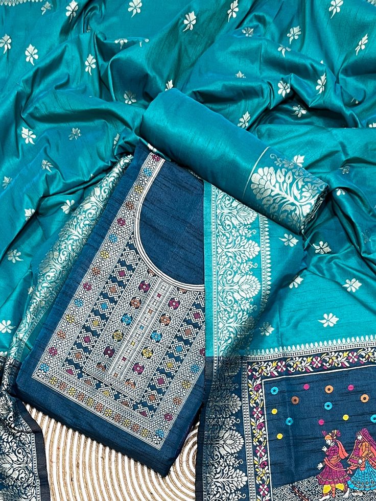 Product Details Teal Blue Unstitched Salwar Suit in kalamkari Raw Silk Elevated with Kalamkari Thread Woven Work Accompanied by an Unstitched Kurta, Bottom and Dupatta with Tassels Comes with the Vishnu Weaves Promise of Premium Quality Size & Fit Kurta & Bottom : 5.20 Mtrs Dupatta : 2.40 Mtrs Material & Care Dry Wash Only Saree Dress, Salwar Suit, Raw Silk, Salwar Suits, Dress Materials, Teal Blue, Tassels, Premium Quality, Weaving