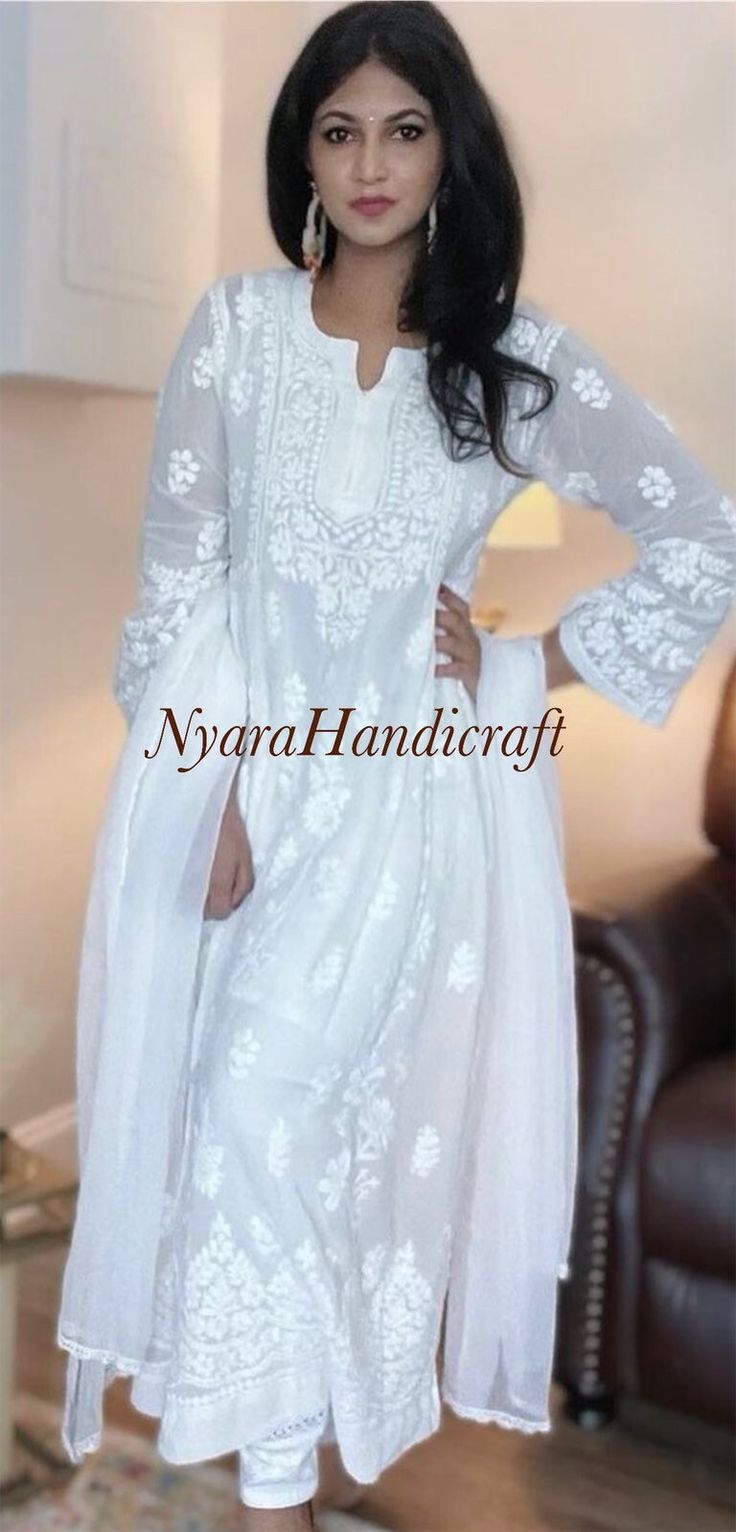 "Classic white Chikankari kurta on a luxurious fabric has great embroidery, speaking highly of the amazing craftsmanship! Chiffon Dupatta and Matching liner included.  \"Embroidery designs vary\" Kurti Length- 50 inches" Luxury Silk Chikankari Embroidered Fabric, Luxury Silver Dupatta With Chikankari Embroidery, Luxury Summer Embroidered Top With Chikankari, Luxury Chikankari Embroidery Maxi Dupatta, Luxury Chikankari Embroidery Saree, Luxury Chikankari Embroidery Blouse For Festive Occasions, Luxury Georgette Dupatta With Chikankari Embroidery, Luxury Chikankari Embroidery Festive Tops, Luxury Classic White Kurta