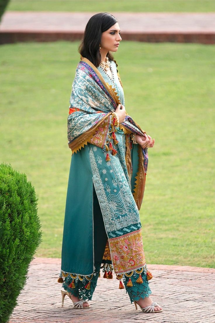 Try Traditional Sea Green Embroidered Pakistani Kameez Salwar Suit Dupatta Propagate utter grandeur in digitally printed tye & dye in shades on a raw silk base. A finely crafted outfit with an extravagant and hypnotically poetic embroidery of resham and sequin. Paired with matching pants and a mystically printed shawl. Embroidered Kameez: The beautiful Pakistani kameez salwar has a beautiful sea green color and it comes in premium quality chiffon fabric. Lavish embroidery work, graceful designs, Blue Jamawar Lawn Suit With Intricate Embroidery, Designer Jamawar Lawn Suit For Festivals, Designer Wear Jamawar Palazzo Set With Dupatta, Designer Jamawar Palazzo Set With Dupatta, Traditional Silk Lawn Suit For Eid, Jamawar Lawn Suit With Intricate Embroidery For Festivals, Traditional Drape Lawn Suit For Eid Ceremonies, Jamawar Lawn Suit With Intricate Embroidery, Transitional Silk Lawn Suit With Traditional Drape