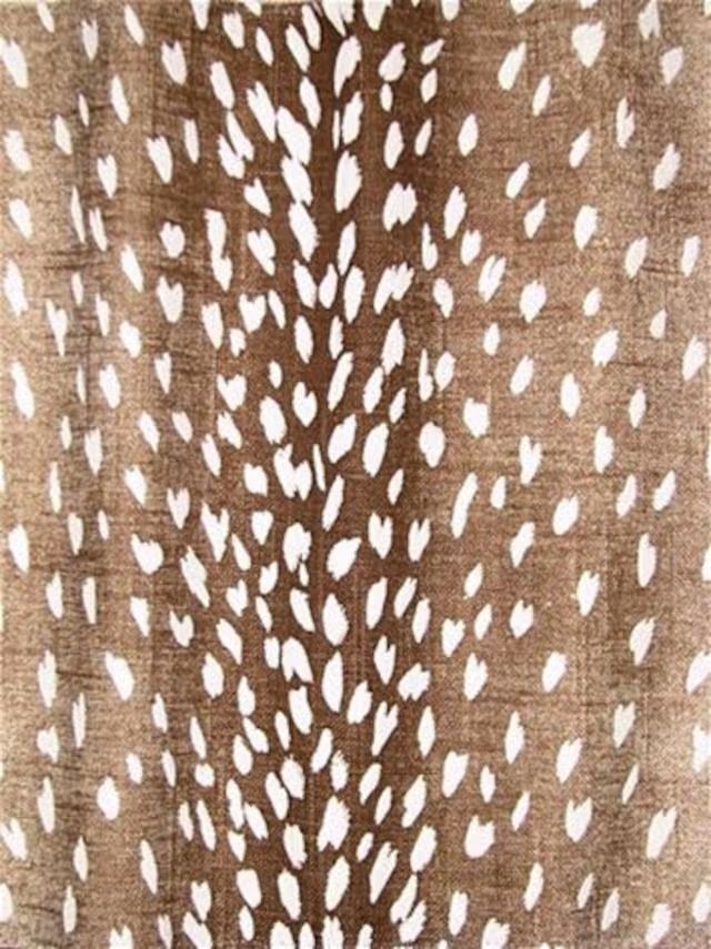 a brown and white animal print fabric