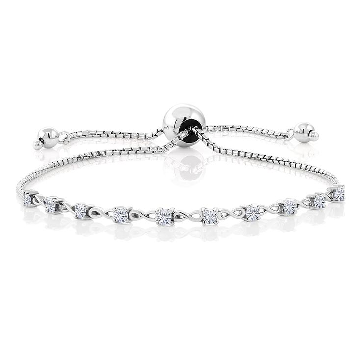 PRICES MAY VARY. Brilliant Moissanite Stones: This bracelet features a row of sparkling moissanite stones with a total carat weight of 0.65 Cttw (carat total weight). This bracelet is designed to fit wrists up to 9 inches in circumference. The adjustable feature ensures a comfortable and secure fit for a wide range of wrist sizes. High-Quality Sterling Silver: Crafted from 925 sterling silver with 925 stamp, this bracelet offers both beauty and durability. The sterling silver setting complements White Bracelets With Sparkling Stones, Silver Diamond Crystal Bracelet, Sterling Silver Bracelet For Anniversary In Diamond White, Adjustable Diamond Jewelry With Stones, Adjustable Sterling Silver Tennis Bracelet In Diamond White, Silver Bracelet With Cubic Zirconia Stones, Adjustable Diamond White Bracelets In Fine Jewelry Style, Adjustable Diamond White Bracelet Fine Jewelry, Adjustable Diamond White Bracelet In Fine Jewelry Style