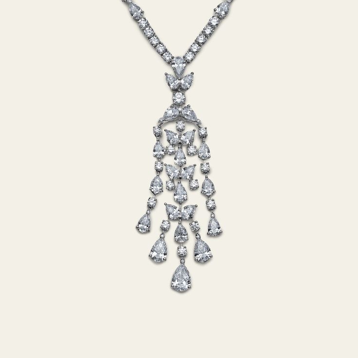 Graff Platinum and White Gold Knifebar Chandelier Necklace with Round and Pear Shape Diamonds Details1 Pear Shape Diamond 1.52ctsColor: D Clarity: VS1 2 Pear Shape Diamonds 2.04cts137 Round Diamonds 33.05ctsColor: Fine White Clarity: VS+TTL Diamond 36.61cts *Comes with official GIA certificate. Luxury Pear-shaped Diamond White Diamond Necklace, Fine Jewelry Platinum Pear-shaped Diamond Necklace, Luxury Pear-shaped Diamond White Necklace, Graff Pendant Necklace, Graff High Jewelry Necklace, Chandelier Necklace, Gia Certificate, Pear Shaped Diamond, Fine Jewelry Collection