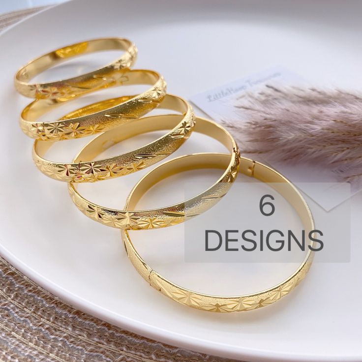 "Beautifully designed and easy to wear, this bangle is the ideal accessory to add to your jewelry collection. The bracelet has Beautiful design. 18k gold plated.  Size:  Diameter 2.4\"   available 6 Design/pattern  High Quality and you will love them These are made of high quality materials 18K gold plated and it will NOT tarnish nor discolor for a long time. High quality gold plated jewelry is a great alternative to solid gold jewelry.  very affordable price. This item is hypoallergenic so it won't irritate sensitive skin. Suitable for all occasions 🦋Jewelry Care:  As with all pieces that are not real gold, it is advised that you take proper jewelry care by not exposing to any harsh chemicals. This quality is excellent & can at least more than a year as long as there is proper care. 🌸Se Gold Tarnish-resistant Round Bangle, Gold-plated Tarnish Resistant Bangle, Gold-plated Tarnish-resistant Bangle, Tarnish Resistant Gold Round Bangle, Dainty Yellow Gold-plated Bangle, Dainty Gold Bangle For Anniversary, Dainty Yellow Gold Plated Bangle, Dainty Gold Jubilee Bangle, Gold Hypoallergenic Bracelet