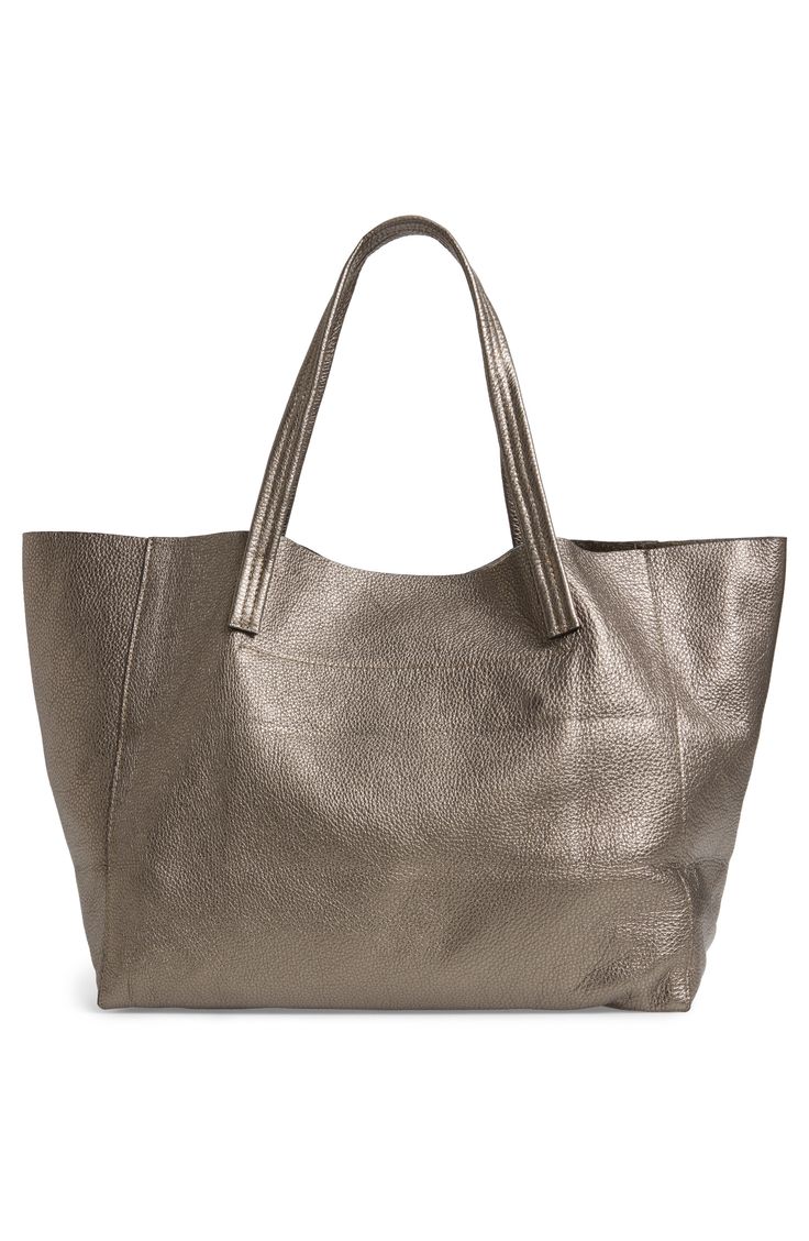 Whether you're going to the gym, the office or class, this Italian-crafted, pebbled-leather tote accommodates everything you need, with room to spare. Its slightly slouchy silhouette and soft suede interior makes this bag stylish inside and out. Open top Over-the-shoulder handles Interior zip pocket Leather Made in Italy Handbags Metallic Textured Leather Rectangular Bag, Textured Leather Rectangular Bag In Metallic, Metallic Tote Bag For Travel, Metallic Travel Tote Bag, Leather Shoulder Bag With Pebbled Texture For Shopping, Metallic Double Handle Bag For Shopping, Gold Textured Leather Travel Bag, Metallic Leather Bag For Shopping, Rectangular Bags With Pebbled Texture For Daily Use