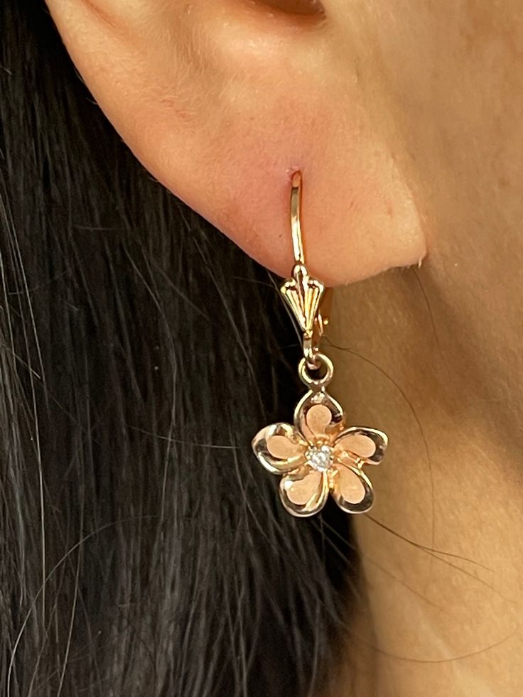 Elegant and Beautiful Hawaiian Plumeria Flower With  Cubic Zirconia Lever Back Earrings in 14Kt Solid  Rose Gold  High Polish Edges 14 Karat Solid Rose Gold GUARANTEED, Authenticated with a 14K Stamp Made With The Highest Quality Craftsmanship Solid 14K Rose Gold Plumeria Flower With Cubic Zirconia Lever Back Drop & Dangle Earrings Total Weight 1.9 grams Solid 14K Rose Gold Plumeria Flower Width 12 Millimeters Length 12 Millimeters Amazing! Gift For Family and Friends! Jewelry Gift Box Included! Elegant Pink Gold Flower Earrings, Rose Gold Single Flower-shaped Earring, Formal Rose Gold Flower Earrings, Fine Jewelry Rose Gold Flower Earrings, Rose Gold Flower-shaped Cubic Zirconia Earrings, Rose Gold Flower-shaped Jewelry With Matching Earrings, Rose Gold Flower-shaped Pierced Earrings, Rose Gold Flower Shaped Pierced Earrings, Rose Gold Flower-shaped Single Earring