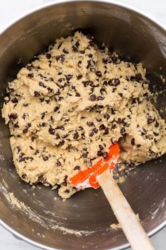 a mixing bowl filled with batter and chocolate chips