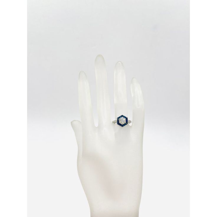 This is part of Chairish’s Fine Jewelry assortment.  Beautiful 0.61 ct. white diamond rounds (center stone is 0.55 ct. with 0.06 ct. white diamond round accent stones on band) with 0.71 ct. blue sapphire baguettes and squares.  Handmade in platinum.  Ring size 6. White Octagon Brilliant Cut Diamond Ring, Diamond White Cluster Ring In Fine Jewelry Style, White Sapphire Ring With Diamond Accents, White Emerald Cut Diamond Cluster Ring, White Gold Octagon Sapphire Ring With Brilliant Cut, Octagon Brilliant Cut Sapphire Ring With Diamond, White Octagon Diamond Ring, White Gold Sapphire Ring With Brilliant Octagon Cut, Octagon Sapphire Ring With Diamond Accent Stones