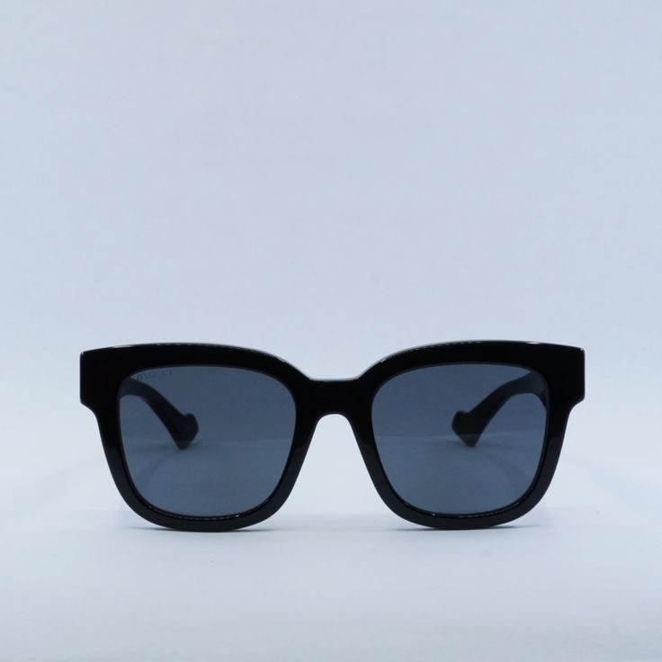 Introducing the stunning Gucci GG0998S 001 Black/Grey sunglasses, a true fashion statement for the modern woman. These stylish shades feature a sleek black acetate frame with a bold square shape, adding a touch of sophistication to any outfit. The grey lenses offer a chic contrast to the black frame, creating a timeless and classic look that is sure to turn heads wherever you go. At OSSA FRAMES, we pride ourselves on offering only the highest quality designer eyewear, and these Gucci sunglasses are no exception. The acetate frame material is not only durable and lightweight, but also incredibly comfortable to wear. With a lens socket width of 52 and a temple length of 145, these sunglasses are designed to fit most face shapes and sizes with ease. The GG0998S model is part of Gucci's latest Black Acetate Cat Eye Sunglasses For Evening, Luxury Matte Black Square Frame Sunglasses, Modern Gucci Cat Eye Sunglasses With Square Frame, Modern Gucci Cat Eye Square Frame Sunglasses, Gucci Modern Square Frame Cat Eye Sunglasses, Trendy Gucci Cat Eye Square Frame Sunglasses, Trendy Gucci Square Frame Cat Eye Sunglasses, Modern Gucci Square Frame Cat Eye Sunglasses, Gucci Cat Eye Sunglasses With Square Frame