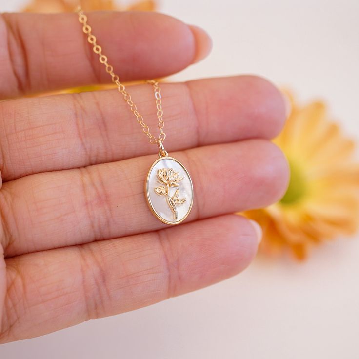 The July Birth Flower Necklace is a mesmerizing addition to our Birth Flower Necklace Collection! The necklace features the stunning Water Lily, the birth flower for July, symbolizing rebirth and enlightenment. The Water Lily's intricate design is flawlessly captured in the pendant, evoking a sense of peacefulness and beauty. The pendant's perfect size and dainty chain make this necklace the ideal accessory for any occasion! Whether you're looking for a meaningful gift for someone special or a w Water Lily Necklace, Birth Flower For July, Flower For July, July Birth Flower, Delphinium Flowers, Lily Necklace, Birth Flower Necklace, Necklace Collection, Dainty Chain