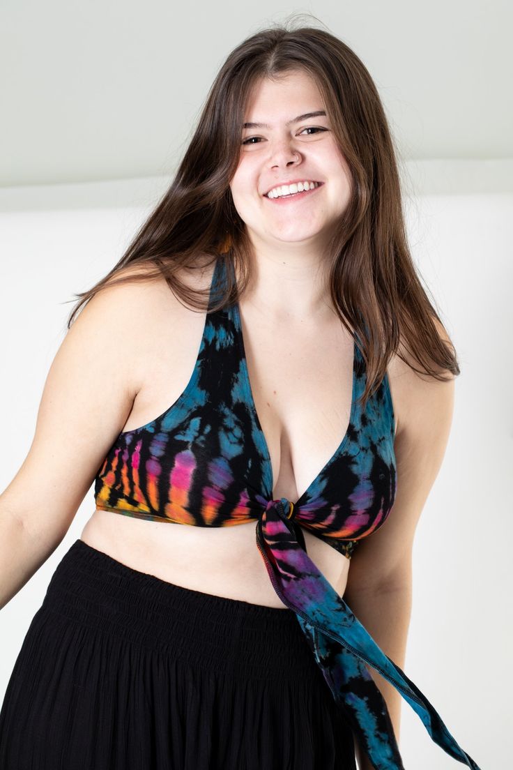 We took one of our favorite tops evenfurther into the psychedelic colorful explosion of hippie fashion.The perfect top for athletic or casual endeavors, it can be wornas an undergarment ora boho bralette, as a supportive garment when exercising, as a swimsuit top, or allon its own as a cuteboho statement top. Tied in the front, or tied around back, it doesn't matter as it is all groovy as long as it's Tie Dye. Yoga Wrap Top, Patchwork Overalls, Stretchy Crop Tops, Purple Teal, Tie Dye Designs, Wrap Top, Swimsuit Tops, Orange And Purple, Hippie Style