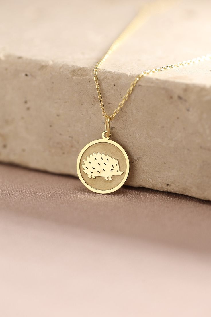 Gold Hedgehog Pendant - Porcupine Gold Necklace ● Material of pendant: Solid Gold 14k ( REAL GOLD ) ● Metal Stamp: 14k ( REAL GOLD ) ● The pendant is available in 5 sizes: - 12,7 mm / 0.5 inches (Diameter) - 14,0 mm / 0,55 inches ( Diameter ) In the photos - 15,3 mm / 0.6 inches ( Diameter ) - 16,5 mm / 0,65 inches ( Diameter ) - 19,1 mm / 0,75 inches ( Diameter ) ( In the photos the size is 14mm / 0.55 inches Diameter ) ( Jump Ring inner diameter: 4 mm ) ● Material of chain: Solid gold 14k ( RE Necklace For Kids, Animal Necklace, 14k Gold Necklace, Pet Necklace, Amulets, Metal Stamping, Gold Style, Real Gold, Gold Pendant