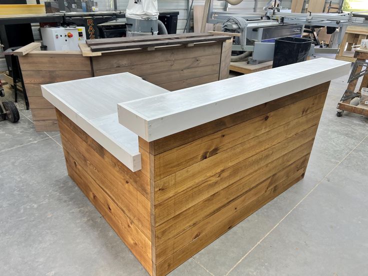 a wooden counter in a shop with other woodworking tools