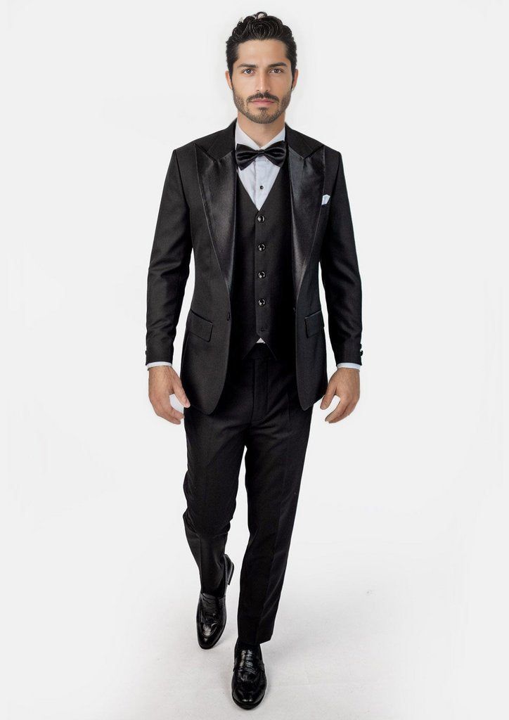 Crafted from a luxurious sharkskin weave wool, the Liberty Black Tuxedo is a sophisticated, statement-making formalwear option. Wide peak lapels in a single button configuration stand out from typical tuxedo styles. Dress to impress with this high-end, premium garment – a modern blend of elegance and refinement. Black Tuxedo With Hidden Button Closure For Party, Tuxedo Suits For Black-tie Gala Events, Notch Lapel Tuxedo For Black-tie Gala Events, Tuxedo Blazer For Black-tie Gala Events, Classic Black Tuxedo For Gala, Fitted Tuxedo With Hidden Button Closure For Parties, Bespoke Fitted Evening Suits, Black Tie Tuxedo Blazer With Hidden Button Closure, Tuxedo Blazer With Hidden Button Closure For Black Tie