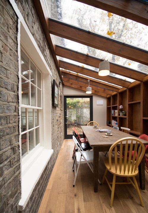 a dining room with a table and chairs