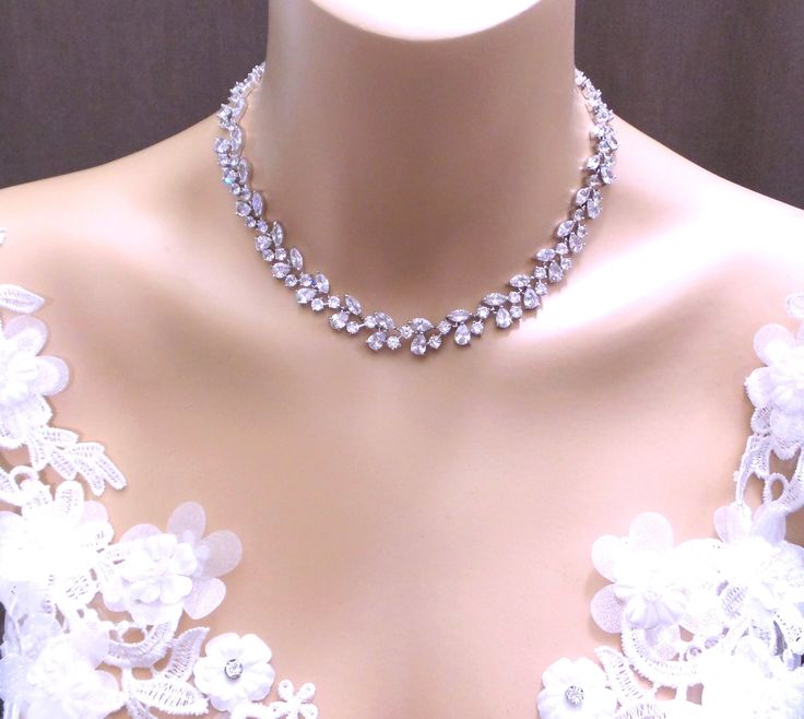 Tarnish resistant rhodium plated metal framed multi-shape luxury AAA quality clear white cubic zirconia statement vine necklace.  matching bracelet and earrings available. Standard 15 16 18 inch. ( can add 2 inch chain extender - just convo me!)  12mm wide matching earrings and bracelet available and sold separately. https://www.etsy.com/listing/543885819/bridal-jewelry-bracelet-prom-wedding?ref=shop_home_active_2 https://www.etsy.com/listing/226142252/bridal-jewelry-bracelet-prom-wedding?ref=sh Bridal Jewelry Bracelets, Necklace Prom, Statement Jewelry Necklace, Wedding Bridesmaid Jewelry, Prom Jewelry, Wedding Bridal Jewellery, Bridesmaid Bracelet, Matching Bracelet, Bridal Bracelet