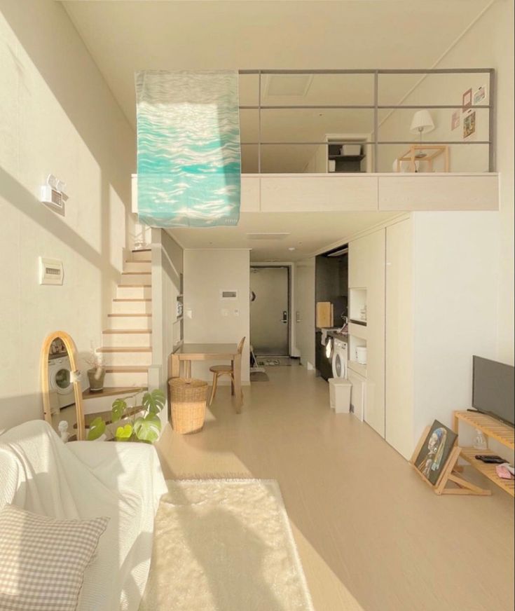 a living room filled with furniture next to a staircase