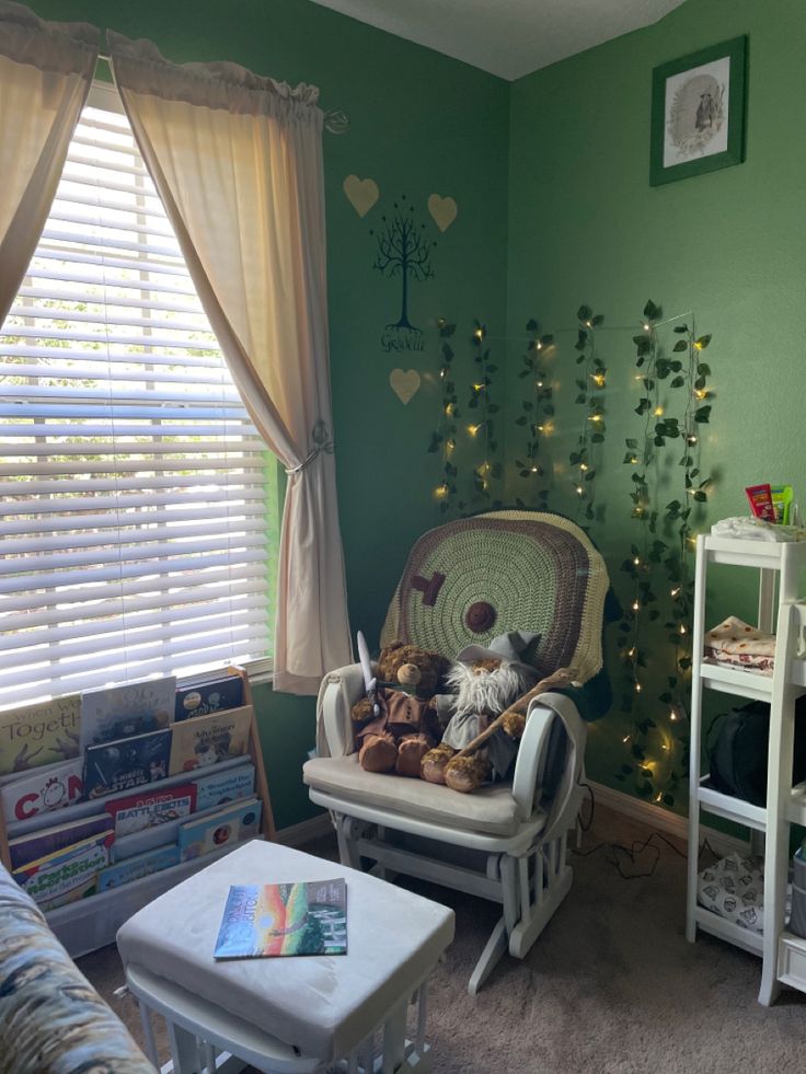 a baby's room with green walls, white furniture and teddy bears on the rocking chair