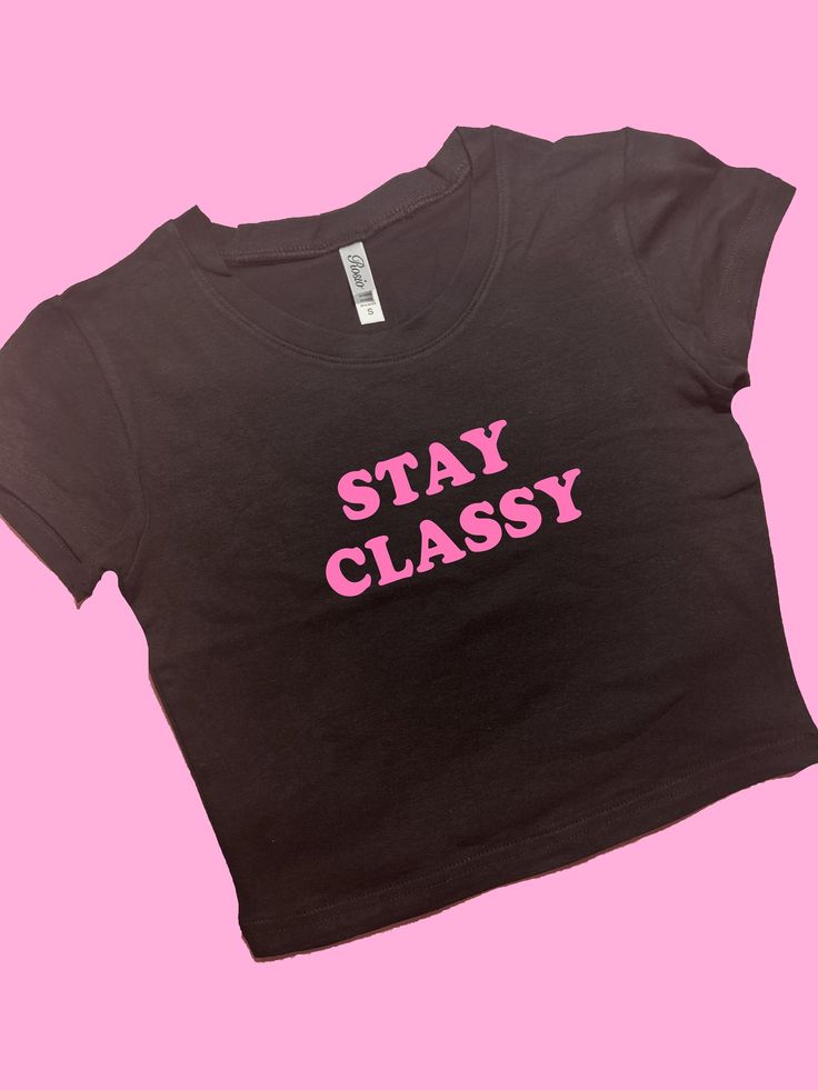 Stay Classy SNUG FIT Crop Top | Crop Top | Graphic Top | Gift For Her | Y2K Baby Tee | Y2K crop top | Gift for friend | Funny Slogan Comfy Top to Lounge in! Actual item may be lighter/darker than pictured. M A T E R I A L S - SNUG FIT - 100% RING SPUN COTTON - Shoulder Taping S I Z I N G - Size chart is available on our listing photos. S H I P P I N G  &  P R O D U C T I O N  T I M E - Production Time is 5 Business Days. (May be delayed during the Holiday Season) - Shipping Time is 2-6 Business Trendy Cropped T-shirt With Letter Print For Streetwear, Cute Fitted Cropped T-shirt For Streetwear, Black Slogan Crop Top T-shirt, Fitted Cropped T-shirt With Letter Print, Trendy Stretch Crop Top For Streetwear, Trendy Crew Neck Crop Top For Streetwear, Trendy Stretch Cropped T-shirt For Streetwear, Pink Stretch Crop Top With Letter Print, Trendy Pink Cropped T-shirt With Letter Print