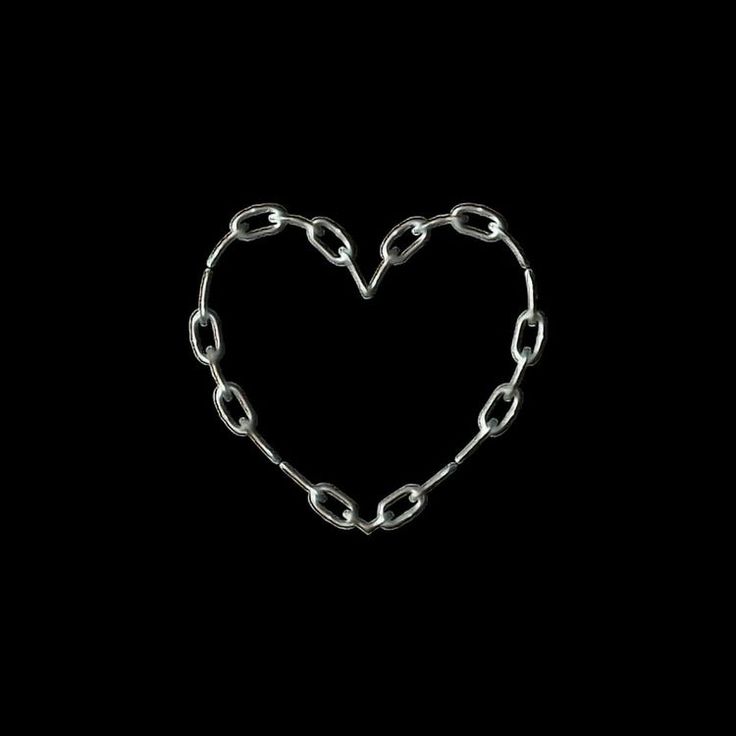 a heart made out of chains on a black background