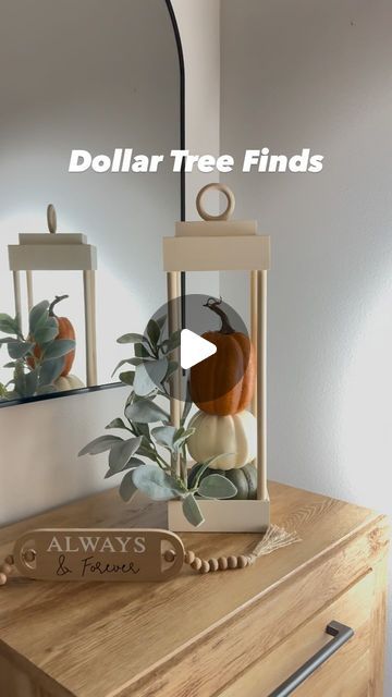 a wooden table with a mirror and vase on it that says dollar tree finds always & friends