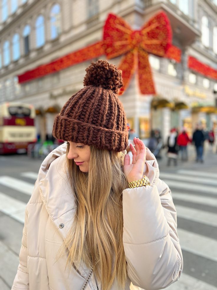 "A chunky knit hat will win your heart at first sight and will warm you in the most severe frosts. Chunky knit will never go out of fashion and will perfectly complement your winter look. We pack each order in our branded gift box. Ideal for a gift. Please don't upset mom and wear hats. Take care of your health. DETAILS - Composition: 40% wool , 60% acryl - 100% handmade - One size: 54-58 cm (21.6\"-22.8\") - We need 4-7 business days to make this order - Available in 16 colors   If you have any Brown Winter Beanie One Size, Casual Winter Hats With Pom Poms, Fall Chunky Knit Beanie, Trendy Brown Knitted Hat, Casual Beanie With Pom Poms, Brown Crochet Hat With Soft Knit For Winter, Chunky Knit Crochet Hat For Cold Weather In Fall, Casual Pom Pom Hat For Cold Weather, Winter Beanie With Pom Poms