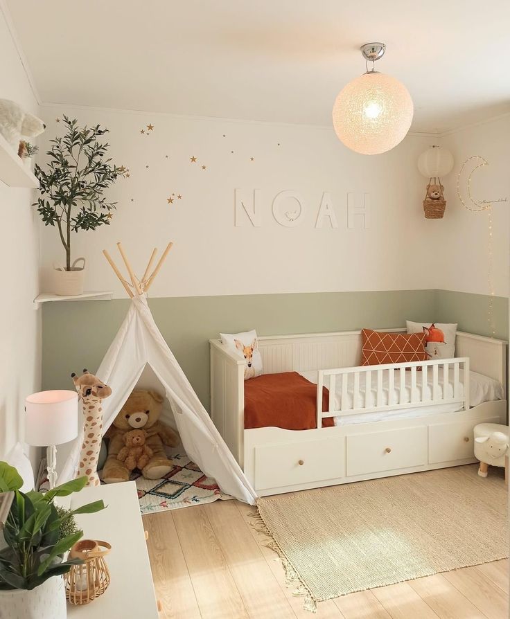 a child's room with a teepee tent and stuffed animals