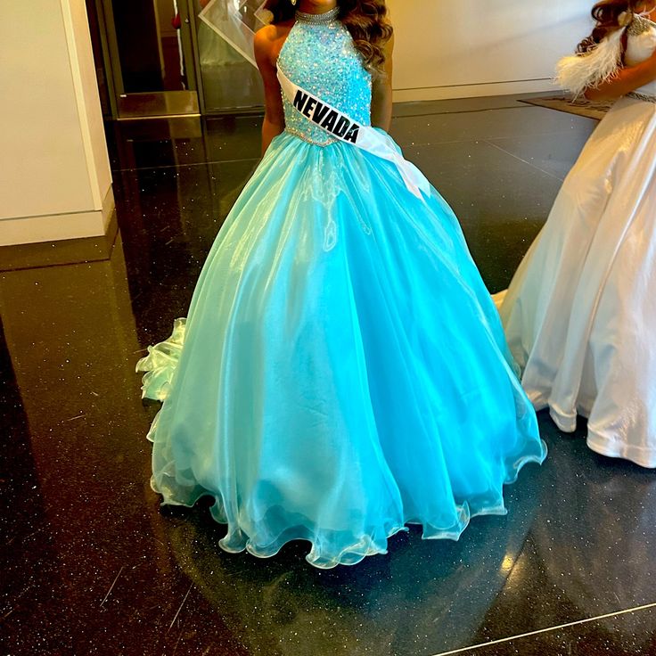 This Gown Was Worn Once For National Pageant In Great Condition Princess Style Light Blue Pageant Dress, Light Blue Princess Style Pageant Dress, Blue Princess Style Floor-length Gown, Blue Princess Gown For Pageants, Blue Princess Ball Gown Pageant Dress, Fitted Blue Ball Gown Pageant Dress, Blue Ball Gown Pageant Dress, Princess Style Blue Gown For Pageant, Blue Ball Gown For Pageants