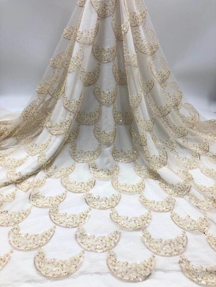 We offer a variety of fashion handmade fabric，those are widely use for wedding dress，garment and fashion cloth. we sell it by yard，our minimum order is 1 yards，and we always package it 15 yards for one roll，the width is about 125cm/45inch Material ： sequins ,mesh ，Rayon,polyester. Symmetrical embroidery floral pattern, with lovely flowers in the middle, scalloped border. You can also cut and use separately. Perfect for dress, tops, wedding veil. You can split the piece up and have one scalloped Party Lace Fabric With Pearl Embroidery, Cream Lace Embroidered Fabric For Party, Cream Embroidered Lace Fabric For Party, Beige Pearl Embroidered Fabric For Party, Beige Embroidered Fabric With Pearl For Party, Beige Embroidered Lace Fabric For Party, Beige Lace Embroidered Fabric For Party, Beige Embroidered Fabric With Pearl Embroidery For Party, Party Embroidered Cream Fabric With Lace Work