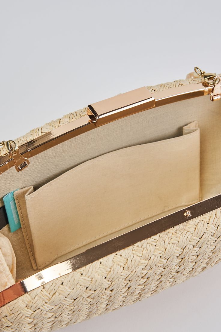 In a Natural tone, this versatile clutch is an ideal summer accessory. With a hard casing featuring a hand woven outer, we adore the detachable beaded shell strap and easy metal snap closure. Crafted to complement our Corsica collection, this charming oval-shaped bag is a must-have clutch of the season. Chic Woven Travel Clutch, Rectangular Clutch For Spring, Chic Woven Clutch For Travel, Spring Rectangular Clutch, Elegant Clutch As Fashion Accessory For Spring, Elegant Spring Fashion Accessory Clutch, Elegant Straw Bag With Detachable Strap For Beach, Elegant Straw Bag With Detachable Strap For Vacation, Chic Summer Clutch For Fashion