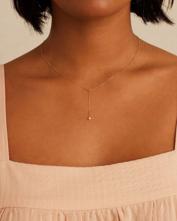 This gorgeous Pearl Lariat Necklace is an elegant addition to any layer. Crafted in 14k solid gold, with a genuine freshwater pearl, this is a timeless piece designed for any occasion. Layer it with other solid gold necklaces to create a unique and eye-catching ensemble. Pearl Lariat Necklace in 14k Solid Gold, Women's by gorjana Dainty Lariat Necklace, Wedding Necklaces For Bride Simple, Pearl Necklace Designs Unique, Peral Necklace, Gold Floral Necklace, Gold And Pearl Necklace, Drop Necklace Gold, Rose Gold Pearl Necklace, Simple Gold Necklace