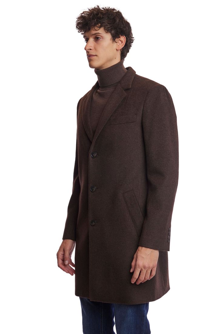 The Chocolate Brown Notch Topcoat is a timeless addition to any wardrobe. Crafted from a poly-wool blend, it features a classic notch collar, faux hair texture, and front pockets for practicality. Its rich chocolate hue and tailored fit make it appropriate for both formal and casual settings. This ensures you stay warm and stylish throughout the colder months.PRODUCT DETAILS: style 6491C slim-fitting long sleeve notch collar faux hair texture poly-wool blend dry clean only imported Fall Suit, Faux Hair, Formal Pants, Knit Outerwear, Hair Texture, Notch Collar, Jacket Sale, Shirt Sale, Top Coat